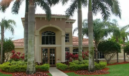 Exterior entrance of an April Housing affordable apartment community in Homestead, Florida.