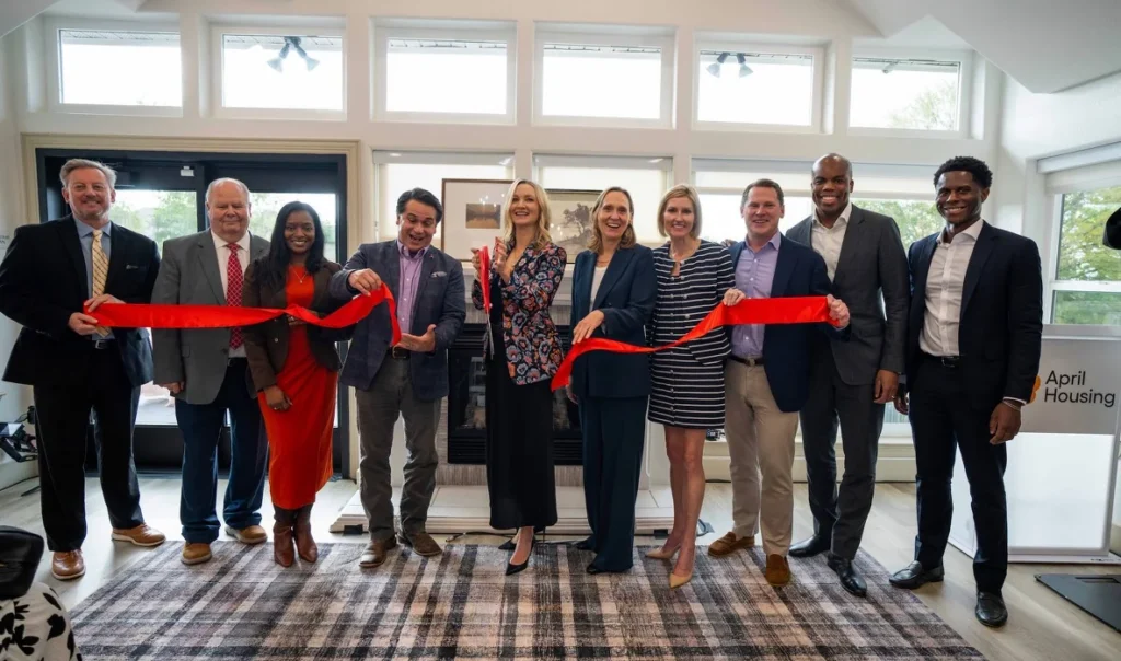 April Housing leaders and Fort Worth officials cut a red ribbon at the grand reopening of Meridian and Wildwood Branch Apartments.